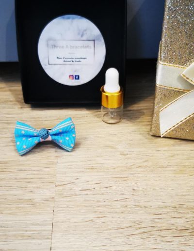 barette noeud à étoile jaune et turquoise et perle de lave turquoise